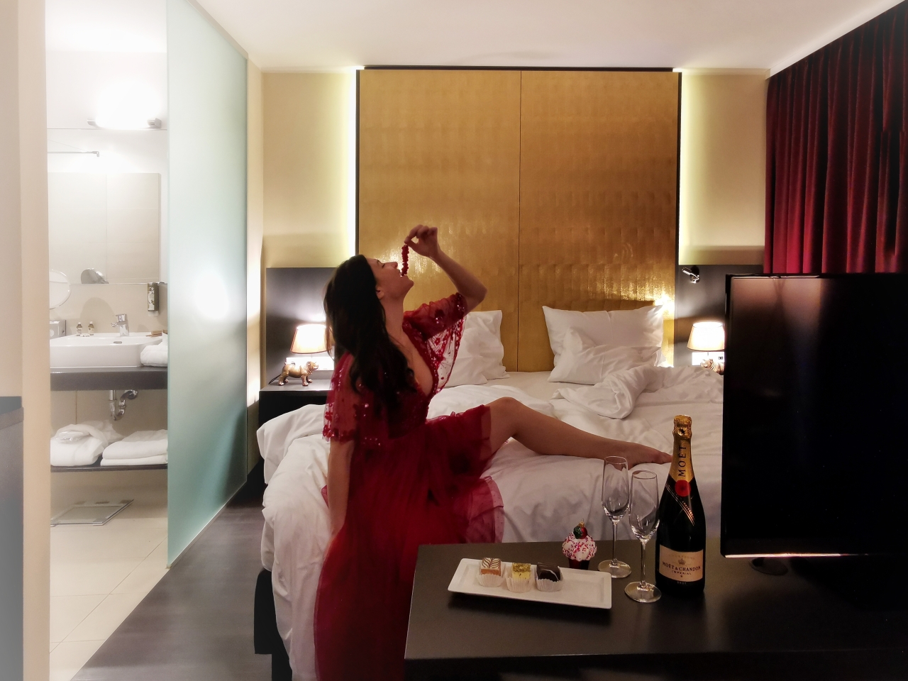 woman-in-a-hotel-suite-with-champagne